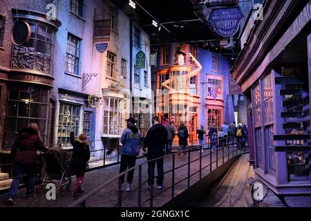 Leavesden, UK: Visitors walk along Diagon Alley, a studio replica of the famous street from the Harry Potter films Stock Photo