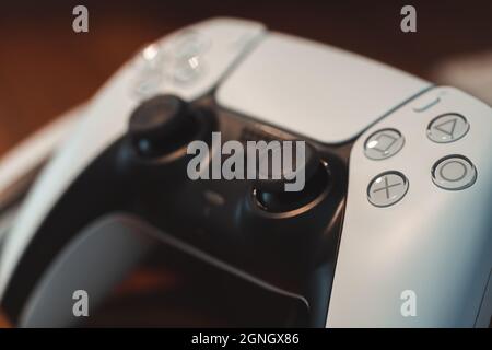 London, UK - May 25, 2021: Close up of white Playstation 5 (PS5) DualSense wireless controller. Playstation 5 is the latest video game console from So Stock Photo