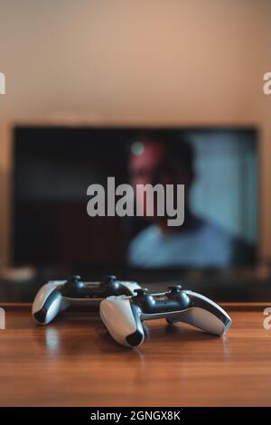 London Uk May 25 21 Two Playstation 5 Ps5 Controllers On The Table Tv On Background Selective Focus Playstation 5 Is The Latest Video Game Stock Photo Alamy