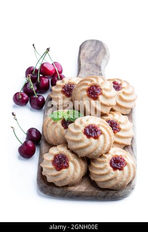 Qurabiya  cookie shortbread with jam on serving board isolated on white Stock Photo