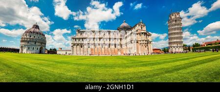 Panoramic spring view of famous Leaning Tower in Pisa. Sunny morning scene with hundreds of tourists in Piazza dei Miracoli (Square of Miracles), Ital Stock Photo