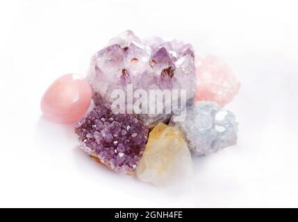 Crystals of amethyst and rose quartz. Gems on a white background. Magic stones. Stock Photo