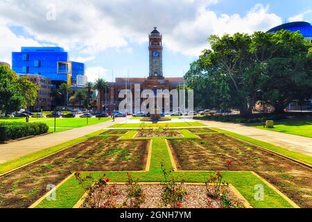 Green square and formal garden around the Town Hall house in Newcastle city on a sunny bright day. Stock Photo