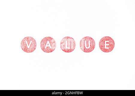 Red color rubber stamp in word value on white paper background Stock Photo