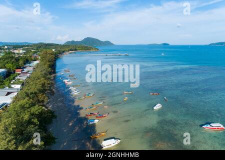 Aerial View of Thai traditional longtail fishing boats in the tropical sea beautiful beach in phuket thailand. Stock Photo