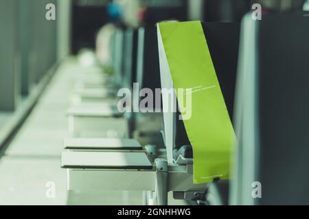 Please Keep Distance Airport Waiting Room Seats Information For Travellers. Seats Divider. Travel During Pandemic Theme. Stock Photo