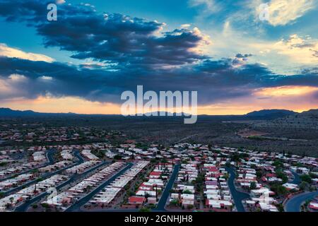 Rows of homes in Green Valley, Arizona with vibrant clouds Stock Photo