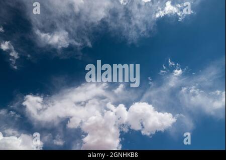 Blue sky with puffy white clouds Stock Photo