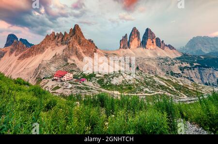 Colorful evening scene of Tre Cime Di Lavaredo mountain peaks. Incredible summer sunset in Dolomiti Alps, South Tyrol, Italy, Europe. Beauty of nature Stock Photo