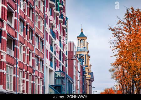 Fragment of typical Dutch architecture in Amsterdam city. Colorful autumn morning in Netherlands, Europe. Traveling concept background. Stock Photo