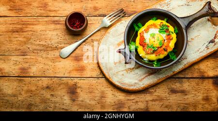 Squash stuffed with couscous and mushrooms. Baked patisson with shakshuka.Space for text Stock Photo