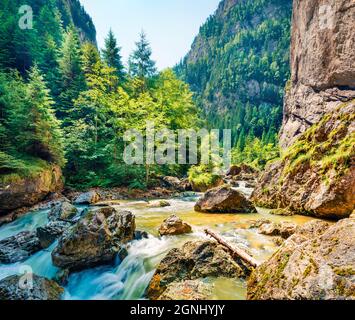 Sunny summer view of Bicaz river. Splendid morning scene of Harghita County, Romania, Europe. Traveling concept background. Stock Photo