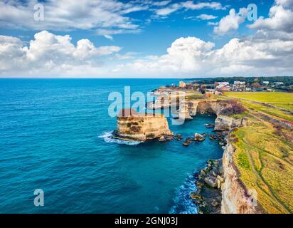 View from flying drone. Aerial spring view of popular tourist attraction - Torre Sant'Andrea. Spectacular morning seascape of Adriatic sea, Torre Sant Stock Photo