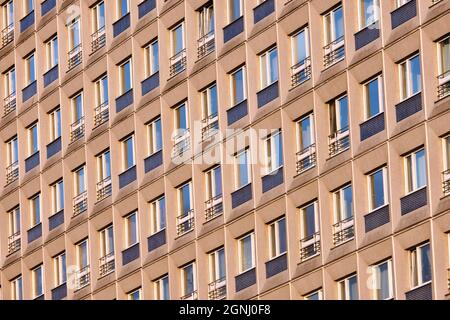 Facade of a typical precast apartment building in the former eastern part of Berlin, Germany Stock Photo