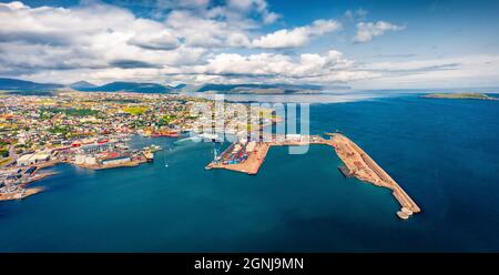 Panoramic summer view from flying drone of Torshavn town. Aerial morning scene of Streymoy island, Faroe, Denmark, Europe. Traveling concept backgroun Stock Photo