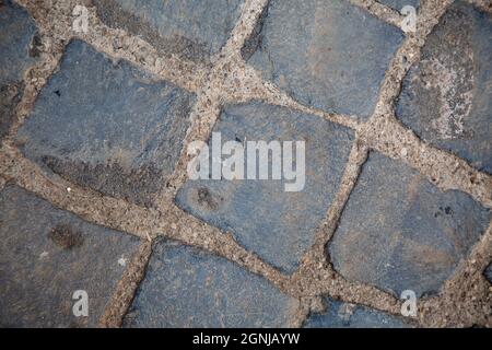 top view to grey square cobblestone pavement. Diagonal geometric composition. Street surface. Wallpaper and background picture. traditional italian Stock Photo