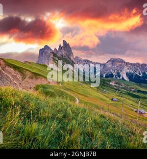 Spectacular sunset on Funes Valley. Stuninng summer view of Furchetta peak. Amazing evening scene of Puez Odle National Park, Dolomiti Alps, Province Stock Photo