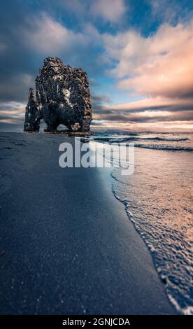 Gorgeous morning view of huge basalt stack - Hvitserkur. Majestic summer scene of eastern shore of the Vatnsnes peninsula, Iceland, Europe. Beauty of Stock Photo