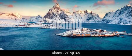 Aerial morning cityscape of Sakrisoy port. Panoramic view of Lofoten Islands with Kvalvik bridge. Amazing winter sunrise on Norwegian sea. Great outdo Stock Photo