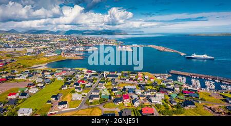 Panoramic summer view from flying drone of Torshavn town. Aerial morning scene of Streymoy island, Faroe, Denmark, Europe. Traveling concept backgroun Stock Photo