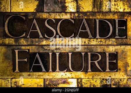 Cascade Failure text on textured grunge copper and vintage gold background Stock Photo
