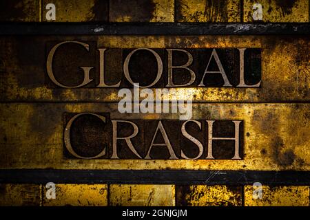 Global Crash text on textured grunge copper and vintage gold background Stock Photo