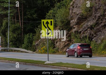 Kristiansand, Norway - August 01 2021: Sign informing about a temporary change in driving lanes Stock Photo