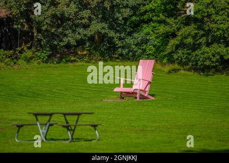 Alingsås, Sweden - August 20 2021: Oversized pink chair in Nolhaga park
