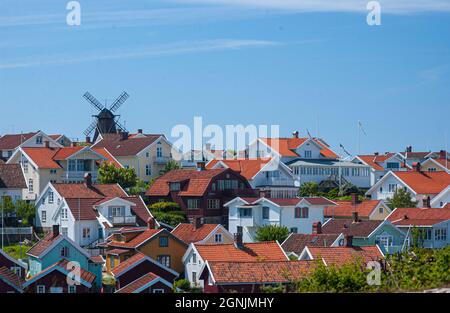 Fiskebäckskil, Sweden - June 09 2006: Traditional houses and windmill of Fiskebäckskil. Stock Photo