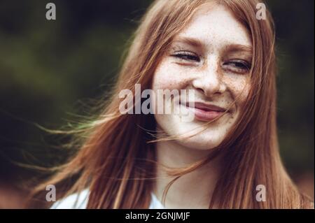 Close-up portrait of young teen freckled ginger girl Stock Photo