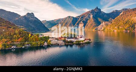 View from flying drone of Maria Kronung church. Colorful autumn scene of Traunsee lake. Nice landscape of Austrian Alps with Traunstein peak on backgr Stock Photo