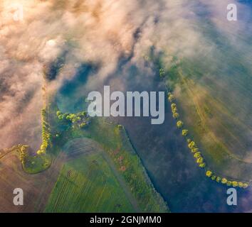 Straight down view from flying drone of Angelivka pond. Foggy morning scene of outskirts of Ternopil town, Ukraine, Europe. Beauty of nature concept b Stock Photo