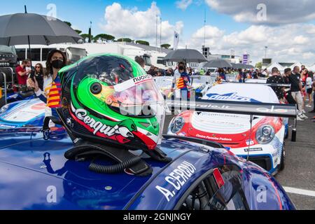 Vallelunga, italy september 19th 2021 Aci racing weekend. Race car driver helmet close up in circuit paddock Porsche carrera show in background Stock Photo