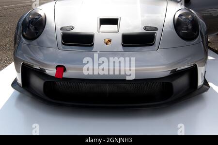 Vallelunga, italy september 19th 2021 Aci racing weekend. Porsche car front hood close up logo on shiny silver luxury car Stock Photo