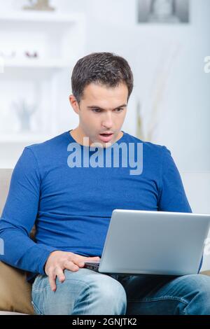 man having trouble with laptop Stock Photo