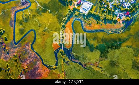 Straight dawn panoramic view from flying drone of bridge over Seret river, Ternopil region, Ukraine, Europe. Spectacular summer scene of green flooded Stock Photo