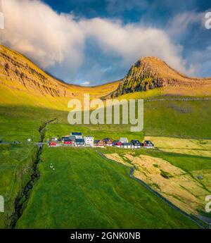 Aerial landscape photography. Bright summer view of Sydradalur village, Kalsoy island. Sunny morning scene of Faroe Islands, Kingdom of Denmark, Europ Stock Photo