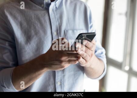 Hand of young business man in casual using virtual app Stock Photo