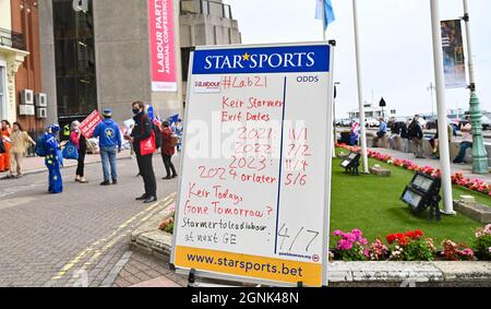 Brighton UK 26th September 2021 -  Keir Starmer exit dates odds outside the Labour Party Conference being held in the Brighton Centre  : Credit Simon Dack / Alamy Live News