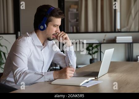 Employee, manager in headset making video call to client Stock Photo