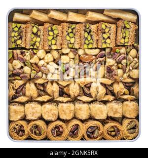 assortment of traditional Turkish baklava pastry in a tin box, a dessert is well also known as persian or lebanese baklava Stock Photo