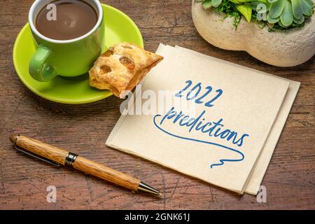 2022 predictions - handwriting on a napkin with a cup of coffee, business and financial trends and expectations in New Year Stock Photo