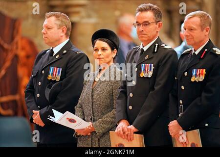 Home Secretary Priti Patel alongside John Apter, National Chair of the Police Federation of England and Wales, (left), and Lincolnshire Police Chief Constable Chris Haward (second right), during the National Police Memorial Day Service at Lincoln Cathedral, Lincoln. Picture date: Sunday September 26, 2021. Stock Photo