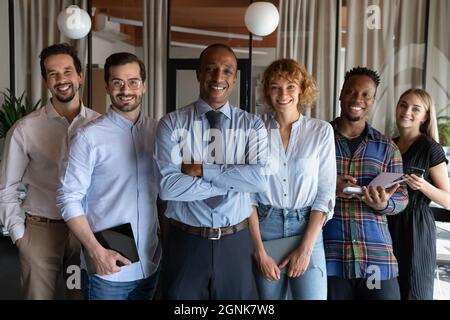 Happy confident African American business leader and millennial diverse team Stock Photo