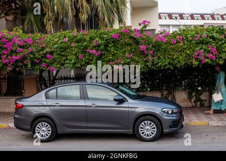 Kemer, Turkey - 08.31.2021: Fiat Egea is a family sedan car on the street parking Stock Photo