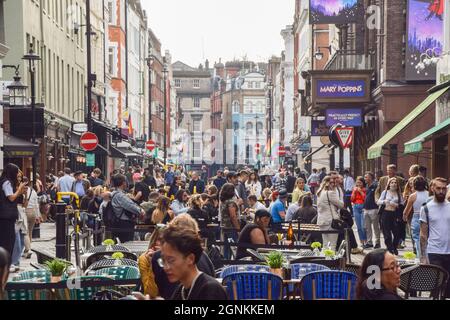 London, United Kingdom. 26th September 2021. Busy bars, cafes and restaurants in Old Compton Street, Soho, as temporary al fresco street seating, introduced as a result of the coronavirus pandemic, continues in Central London. Credit: Vuk Valcic / Alamy Live News Stock Photo