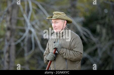 Siberia, Russia. 26th Sep, 2021. Russian President Vladimir Putin enjoys the wilderness during a short vacation with Defense Minister Sergei Shoigu to fish and hike early September shown in images released September 26, 2021 in the Siberian Federal District of Russia. Putin stopped over during a working visit to the Primorye and the Amur Region of the Russian Far East. Credit: Alexei Druzhinin/Kremlin Pool/Alamy Live News Stock Photo