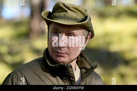 Siberia, Russia. 26th Sep, 2021. Russian President Vladimir Putin enjoys the wilderness during a short vacation with Defense Minister Sergei Shoigu to fish and hike early September shown in images released September 26, 2021 in the Siberian Federal District of Russia. Putin stopped over during a working visit to the Primorye and the Amur Region of the Russian Far East. Credit: Alexei Druzhinin/Kremlin Pool/Alamy Live News Stock Photo