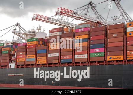 Southampton, England, UK. 2021.  Shipping containers stacked on a container ship alongside in a deep water port. Stock Photo