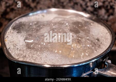 Saucepan Boiling Potatoes On A Hob Cooking Food With No People Stock Photo